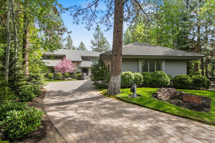 This elegant custom home located at the end of one of Broken Top's most peaceful cul-de-sacs & nestled on an exceptionally private lot enjoys spectacular views overlooking the 15th green & fairway. Designed by Steve Van Sant, this is the first time the home has been offered. Beautifully landscaped courtyard w/ tranquil water feature provides a welcoming sanctuary leading to the impressive entry hall & spacious great room w/ grand stone fireplace, soaring ceilings & wall of windows majestically overlooking the park-like setting & golf course. Around the corner lies the light & bright kitchen equipped w/ new gourmet appliances, breakfast nook & cozy sitting room. French doors lead to utility, office, bath, large 3-car garage & temp-controlled wine room. Main level also features two peaceful en-suite guest rooms. The supremely restful owner's suite offers sweeping tree-house views, gas fireplace & spacious bath w/ a private office/library down the hall w/ its own golf course view balcony.