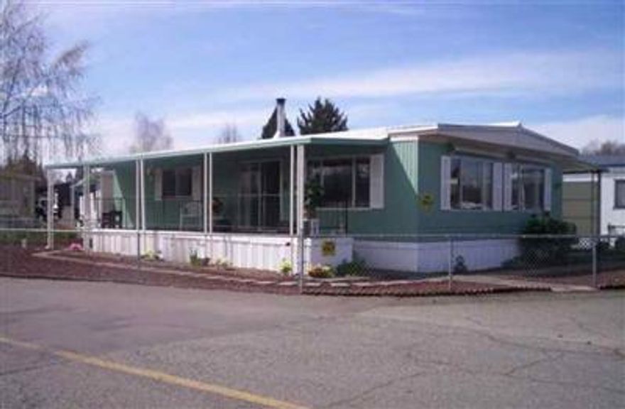 LIGHT & BRIGHT MANUFACTURED HOME - With surrounding views of wildlife on the lake in your front yard. Exceptional storage inside & out. Manufactured home, no yard maintenance, 55+ community, large clubhouse. Beautiful mountain views surrounding this rare find. $54,900.