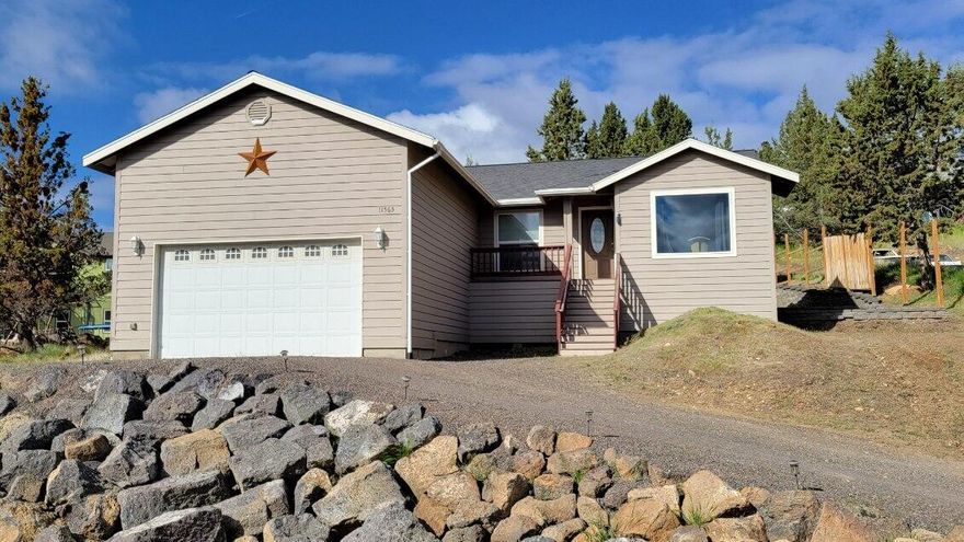 Be a part of a great community with a community pool, horse stables, walking and off-road trails, small lake, clubhouse and more. Located north of Prineville at the base of Grizzly, this 4 bedroom, 2 bath home could be just what you have been looking for. Home has tile kitchen countertops and back splash, tile floors in entry and bathrooms, laminate in kitchen/dining area and carpet throughout living room and bedrooms. There is a large picture window facing east capturing an amazing view of terrain and rock formation. The oversized garage has extra height for a variety of storage concepts. A very private patio area is on the back side of the house that is accessible through a sliding glass door in the dining room and a sliding glass door in the primary bedroom. One side of the home consists of a tiered landscape area and there is additional parking on the other side next to garage. Additional maps and information available.