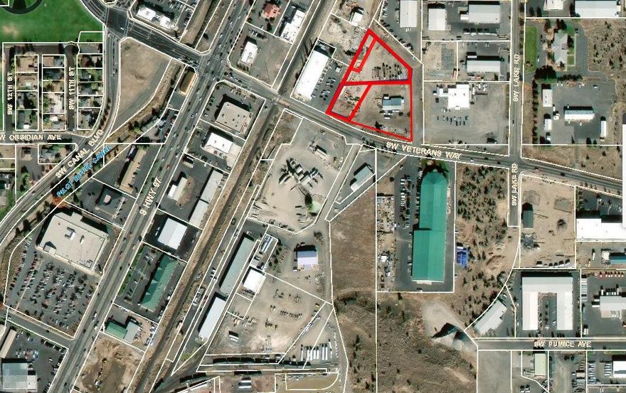 This 3.03+/- AC is comprised of 4 tax lots (See info)  & 4,360+/- Commercial building. This listing is a  portion of larger 6.9 acre parcel, M-2 zoned parcel well located on Veterans Way and 0.20 mile from Highway 97 and less than 1 mile to Redmond Airport. This is an excellent opportunity for an owner/user to construct their own facility. Utilities are established to the property line on Veterans Way. Clean Phase II (06/15/22)-weigh station within Enterprise Zone. The M2 zoning (heavy industrial) is intended to promote the economic diversification by allowing a wide range of industrial and heavy commercial uses and providing sufficient land for industries that have a more pronounced impact on the urban environment because of noise, smoke, air and other emissions or because of traffic and other operating characteristics associated with these industries. Contact listing broker for additional information.