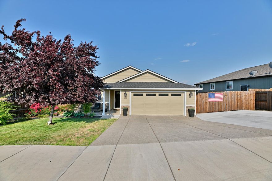 Pride of craftsmanship shines in this beautiful custom-built home, ideally located just minutes from town and top-rated schools, and surrounded by other newer homes. Enjoy sweeping views and a spacious open-concept layout with vaulted ceilings, perfect for modern living. The gourmet kitchen features granite countertops, upgraded stainless steel appliances, custom cabinetry, a large pantry, engineered hardwood that flows into the dining area and entry. The living room is bright and welcoming, while the expansive master suite offers a walk-in closet, dual sinks. Additional highlights include a finished 2-car garage, upgraded electrical throughout, fiber optic lines, wired for generated power also! Tile flooring in the bathrooms and laundry room adds a touch of elegance and durability. Step outside to beautifully full fenced & landscaped back yard with timed sprinklers and drip system, a covered back patio, custom 10X20 secure shed, gated Covered boat, RV, or toy parking.