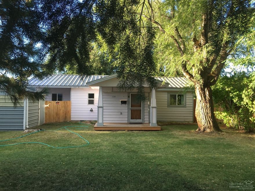 Solid home, all newer electrical & plumbing, fenced back yard with alley access, cute sunroom, lots of lilac trees, certified wood stove, needs a little TLC, small shop. Sold AS IS.
