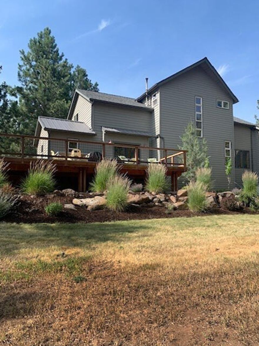 Unbelievable Oasis right here in Bend. Nothing like this awesome must-see home in this unique, private neighborhood on private dead end road. Fully renovated, remodeled; 2106 sq. ft. 3 bed, 2.5 bath home on 1.23 acres. Alder Cabinets and solid core alder doors, birch floors, wool carpeting and a ceramic tile bath are just a few of the great home features. Parks & Rec and HOA common area trails will, in minutes, take you to the Deschutes River Trail. Privacy is abundant here with this beautiful home set back off and above the road. A huge wrap around elevated paver deck looks directly out to a high rock outcropping. A private front porch & patio looks out to wooded serenity. Comfortable living with a large living/dining area & a separate den & a separate office on main level.  Kitchen boasts granite counters, custom cabinetry, pantry, breakfast nook, & high end stainless steel appliances. Refrigerator, washer, dryer and pellet stove included. Roof new in 2019.
