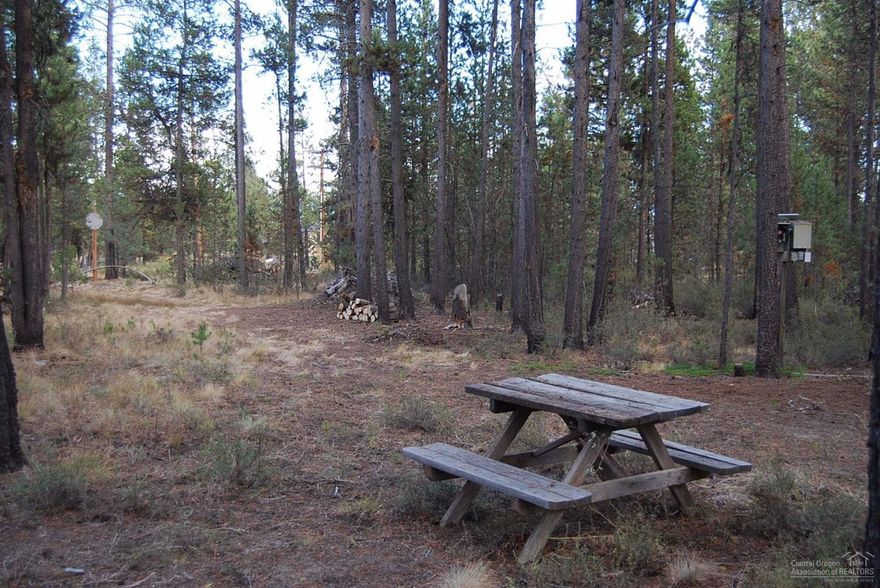 Quiet in the pines. 1.7-acre homesite across the street from the Little Deschutes River. Sunriver area buildable site septic approved and with a 200+ foot cased well for your dream retreat. One lot away from the Little Deschutes River, this level and nicely treed parcel just needs your ideas. National Forest nearby and rivers, Cascade Lakes, Newberry National Monument and Mt Bachelor all within 45 minutes