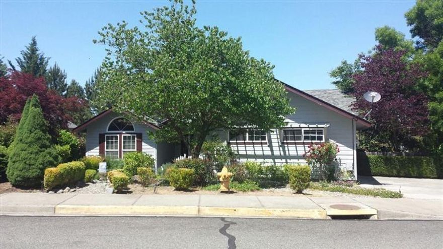 Very Nice home in great condition, excellent neighborhood, ready to move in, vaulted ceilings, with high quality laminate throughout the living room, dining, kitchen and hallways, gives this a spacious feeling with granite in kitchen and bathrooms, nice walk-in closet in master suite with double door entry. Nicely landscaped with drip and deck to enjoy the view and nice water feature in back-yard. Room in driveway for other vehicles or small RV.