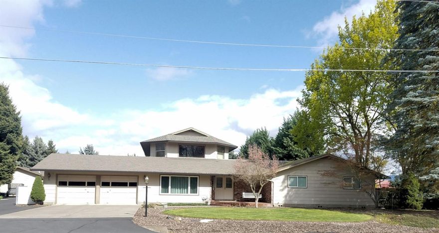 Beautifully remodeled, well-built home on 1 acre. This 4 bedroom home could easily be a 2 family set-up. First floor living & family rooms are very spacious. There is a large pantry/laundry room & wide hallways. A beautiful sun room faces the rising sun. Upstairs is a very large great room with a bedroom & bathroom. Attached 2 car garage and finished 24x40 shop. Paved parking includes an RV space with full hookups. Outside is a huge backyard, flower beds, garden area, fruit tree selection. Recent remodel included updated windows, kitchen, bathrooms, pantry/laundry room and new carpet in bedrooms.