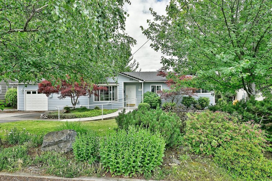 This extremely well cared for mid century home is located in a desirable East Medford Neighborhood. Home has been lovingly maintained and features charm of it's time with shiplap and open beam ceilings, hardwood floors,two fireplaces, and an abundance of built in bookshelves and cabinets. In addition this home has been updated with Milguard Vinyl windows throughout, a sky light in the kitchen, and a new insulated garage door. This home offers a tremendous amount of storage space inside and out, plus an attached finished workshop/hobby room off the garage. Outside is a large covered composite deck over a patio on the lower level. The mature landscape here is beautiful and impressive, providing for a private setting in the backyard that offers curbed lawns, and concrete walkways. One year Fidelity Home Warranty included. Call to schedule a tour of this wonderful home today!