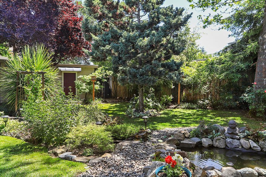 Mid Century Modern Bungalow w/Private Oasis Fenced & Gated Backyard in heart of Oldtown Medford. Quaint neighborhood side street close to Courthouse, Schools, an amazing Taqueria/excellent location. Tastefully Updated: Refinished Wood flrs; Newer: Gas Fireplace insert, Tile & Wood lam flrs, Beautiful Barn Door Sliders, Bathroom Remodel, Utility rm w/Sink & Pantry, Int. & Ext. Paint, Roof, Electrical Panel, 2nd Water Heater, Gas Range, Fridge, S/S D/W; Orig. Vintage Metal Cabinetry w/ Back-lit Glass Panels, Period-style Sink w/ New Pull-Out Touch n Go Faucet & New Garden Window. Gas Furnace/Forced Air. 3 bedrooms plus Den, spacious Master Wing w/ Access to Oasis & private Hot Tub area. 2 Ponds w/ Fountains. Block/Stone Pathways, Outdoor Bar, Pergola & Patio. Gorgeous Gardens: Huge Wisteria, Trumpet Vine, Grapes, Banana trees, Hastes, Columbine & more. Dojo (all-purpose bldg w/ 2 rooms) for Storage/Hobbies. Car-carport & Camper parking & Alley access. Home Warranty. Appt Only.