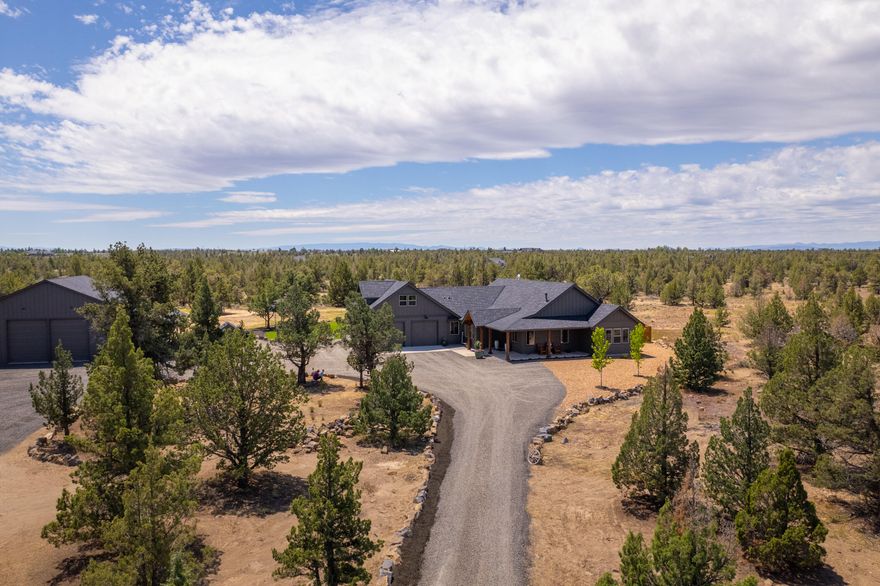 Spectacular custom home with Cascade Mountain views, modern open floorplan, huge vaulted ceilings in the living areas, a spacious kitchen with island, quartz countertops, farmhouse sink and more. The master suite features an oversized custom shower and soaking tub, dual vanities with the bedroom opening to the huge covered porch to enjoy the mountain views. The secondary bedrooms are spacious with walk-in closets and separation from the master bedroom. Upstairs features a huge bonus room with plenty of space to entertain. Outside features a huge covered patio perfect for get togethers and meals. The landscaping is immaculate with a rear lawn and drip line for trees & shrubs. In addition to the home this property features a 2304 square foot shop with 14 foot roll up doors to fit all your toys or equipment. The shop also features an office space, and 2 carports for addt'l covered parking. At just 2 years old this home is truly turnkey and will please the most discriminating buyers.