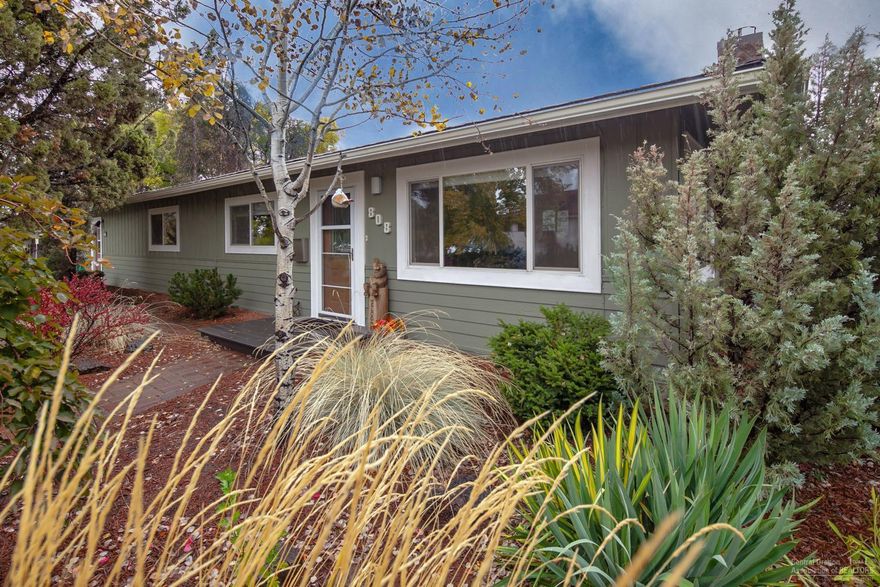 Mid century classic just minutes from downtown Redmond. Nestled inside mature landscaping on a corner lot on a dead end street w/alley access, this home has privacy! Completely updated & remodeled inside & out. Well appointed interior w/solid surface counters, quality carpets & laminate flooring. Double Master or great for a room mate situation. Den/Office off entry. New paint outside w/paver walkways, large deck, green house & 2 storage sheds. Easy RV & toy parking, turn key! Room to build a shop.