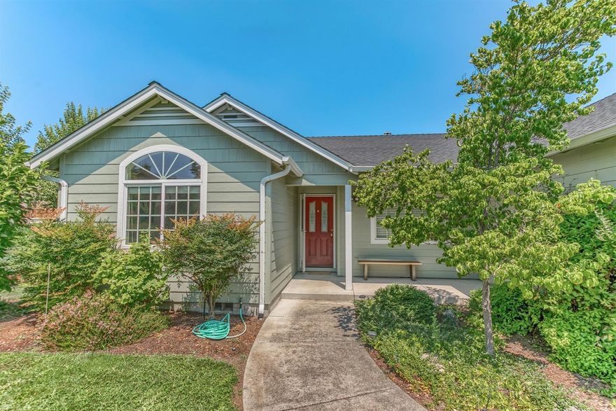 You will love this park-like setting so close to downtown Talent! This single-level, 2004 year built home has close to acre of beautiful, irrigated gardens. Located down a flag lot, this property has unexpected privacy and amazing views of Grizzly Peak and the surrounding hills. The master suite is on one side of the great room, two additional bedrooms on the other side. Vaulted ceilings and lots of windows/sliding glass doors make this home full of light and space. Gas appliances. Great condition! Come make this home yours!