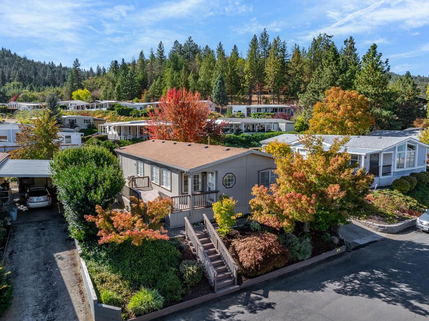 Outstanding home in one of Medford's premier 55+ parks! Just minutes to Jacksonville and surrounded by vineyards and gorgeous mountains!  This 1456 Square Foot, built in 1990 home has been well cared for and maintained to perfection.  Beautiful landscaping, private patio, covered protected carport with wood awning and large storage room/shop. The bright floorplan offers an abundance of windows and natural light, a large kitchen with pantry, gas range, formal dining room, an office/craft room, skylights, 2 bedrooms, and 2 baths, the primary bath boasts a step-in shower and double sinks while the second bath has a bathtub/shower combination. Move in Ready! Call for your personal tour!