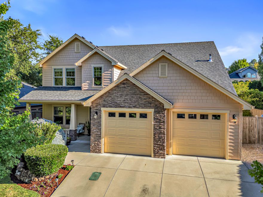 Welcome to this exceptional 4-bedroom plus office home (potential 5th bedroom) nestled on a beautifully landscaped .19-acre lot. Upon entering the home you will be greeted by a grand/vaulted family room with gas fireplace,  leading to open/spacious kitchen. The luxurious downstairs master suite offers dual sinks, a jetted soaking tub, separate shower, walk-in closet, and private patio access. The spacious great room flows seamlessly with the convenient main-floor office while upstairs features three additional bedrooms, full guest bathroom, and valuable storage space above the garage. With extra 2.5 bathrooms, this home balances comfort and functionality for all your guests and family. Outside, enjoy the mature landscaping, covered patio and gated RV parking - all without restrictive HOA fees. This sought-after Summerfield location offers nice walking areas, close to shopping, medical, and the Rogue Valley Country Club. Wonderful home to tour!