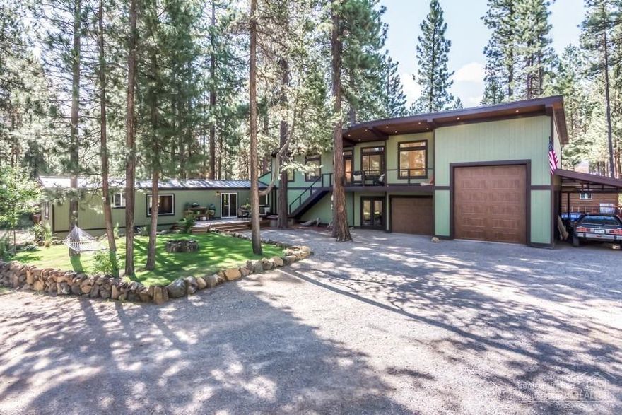 Masterful design meets National Forest is embodied in this 2-bed/2-bath forest retreat w/one-of-a-kind living spaces.You will love this immaculately designed 1560-sqft home nestled against Ann Butte & acres of National Forest.Professionally designed 750 sqft newly constructed master suite & 1150 sqft shop/garage space.Views were preserved from almost every nook.Every detail carefully selected & quality crafted.Highlights include closed cell foam insulation,smart lighting & related products,Navien tank less water heater, new central heat/AC throughout,heated bathroom floor,hickory floors,& much more.The suite boasts a propane Jotul fireplace in the seating area,French doors opening up to a deck,a drop-down entertainment system, Bose built-in sound system,sleek en-suite bath and showers,& a generous walk-in closet.This home includes stainless-steel appliances,double convection ovens,hot tub,and much more.This is a must see private forest retreat!Quality high-end finishes!