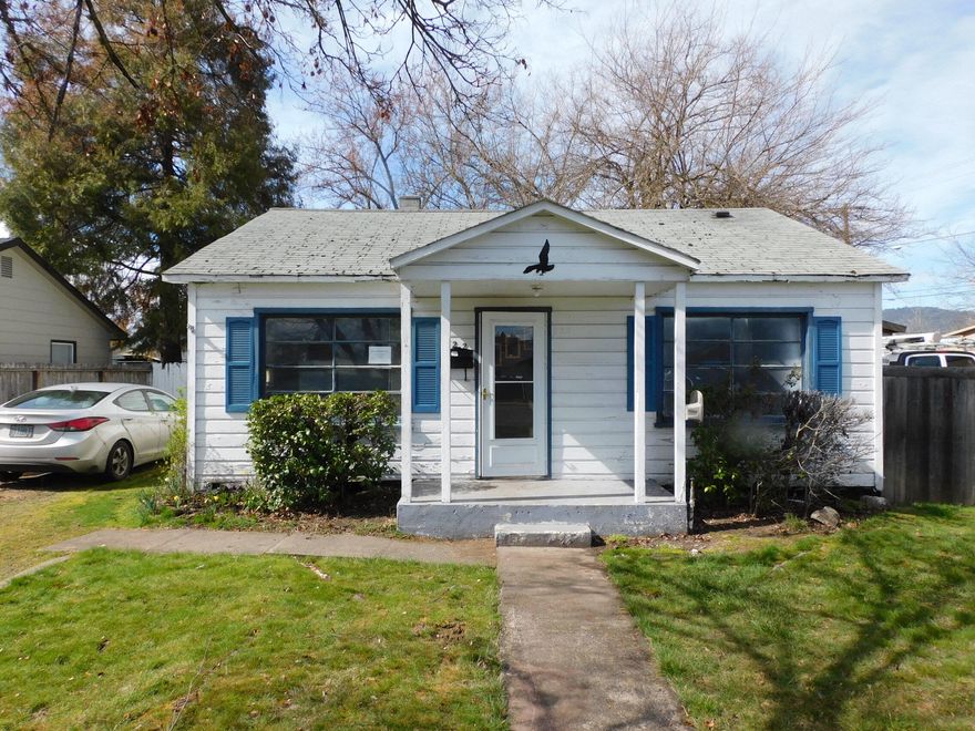 Outstanding price! No listed comparable property in Central Point has been priced for less in over two years! This cottage was with the previous family for around 50 years or more. Hardwood floors could be made to sparkle again. Gas furnace covered cement patio. The garage has lots of built-ins and a work space. The backyard is fenced. Just a walk to the park and Central Point Elementary school. See Instructions.