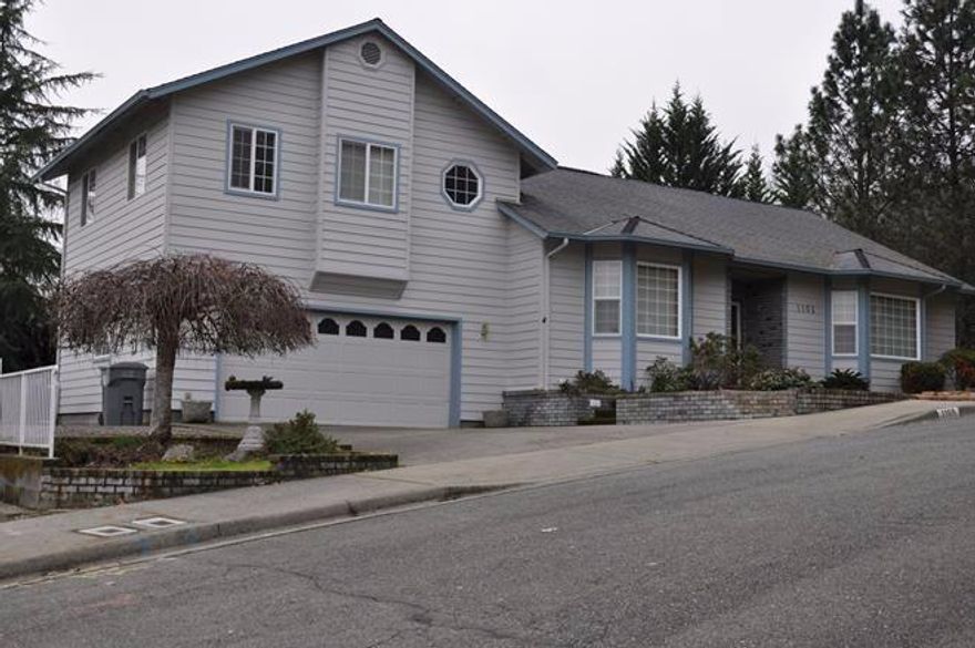 Great NW Grants Pass Neighborhood located near the top of Regent Drive! Here's a beautiful view home built in 1996 that's move in ready. Home features 3 bedrooms, 2 1/2 baths, with the master bedroom located on the main level. Upstairs you'll find 2 additional bedrooms, full bathroom and a loft area. Kitchen boasts of abundant cabinets, pantry and a large island. Eating area has a slider that exits out to the raised deck. There is extra parking on side of home for boat or other toys. All cabinets and workbench stay in the garage and under the house (outside entry) you will find a workshop and even more storage. All information deemed reliable but not verified; anyone considering the purchase of this property should perform their own investigation into the uses and condition of the property.