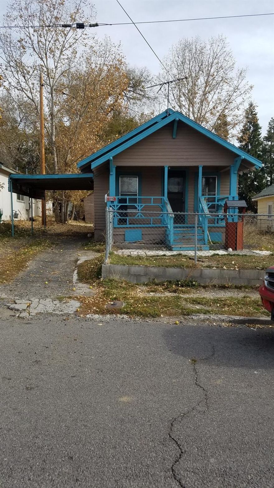 FIXER AS IS Cottage home that could be adorable! 2 bedroom 1 bath PLUS an extra room Nice sized living room and large kitchen The laundry room and extra room are not on a foundation Fenced yard, carport Take a look !