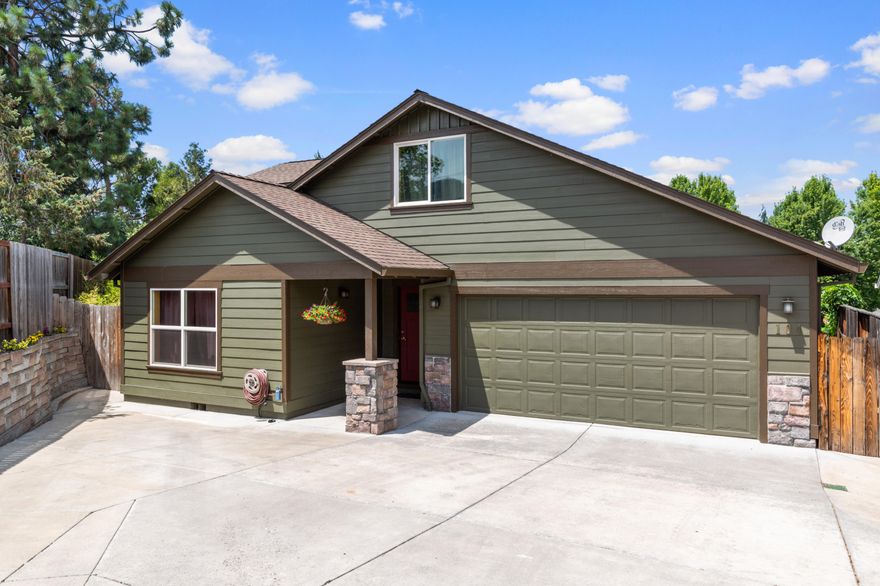 Welcome to this beautiful Craftsman home located in the highly desirable Spruce Landing. This community offers a gated pool, and common areas with walking trails and peaceful places to relax. Home features 5 bedrooms and 3 baths, with large open floor plan. Great room features vaulted ceilings, skylight, dining room for all your family gatherings and a 
 gas fireplace. Master bedroom features large walk in closet and large shower. Laundry room and Master are right off the kitchen, 2 bedrooms and bath are also on the bottom floor. 2 bedrooms and a bath are on the second floor. Kitchen features granite counters and stainless appliances, with view of the great room. Property is beautifully landscaped with large covered patio, water feature, covered hot tub, custom built swing set and playhouse, large garden area, 2 storage sheds and several fruit trees including pear, cherry, apricot, peach, plum, and apple. This is a must tour!!!