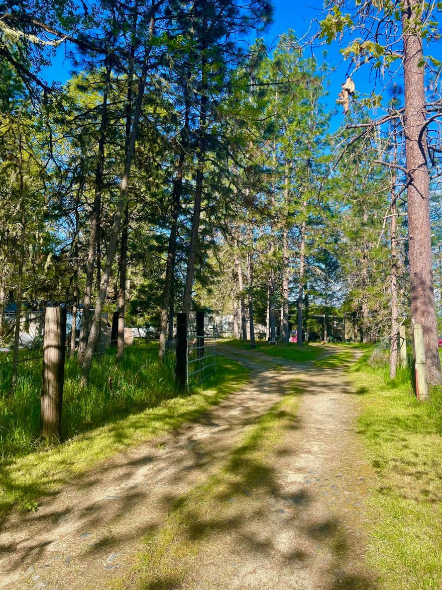 Opportunity knocks!!  2.5 flat usable acres with livable1972 manufactured home.
2 bedroom, 1 bath, 840 sqft. Detached garage/shop. Per seller, well is over 25gpm. Come build your dream.  Seller financing possible.