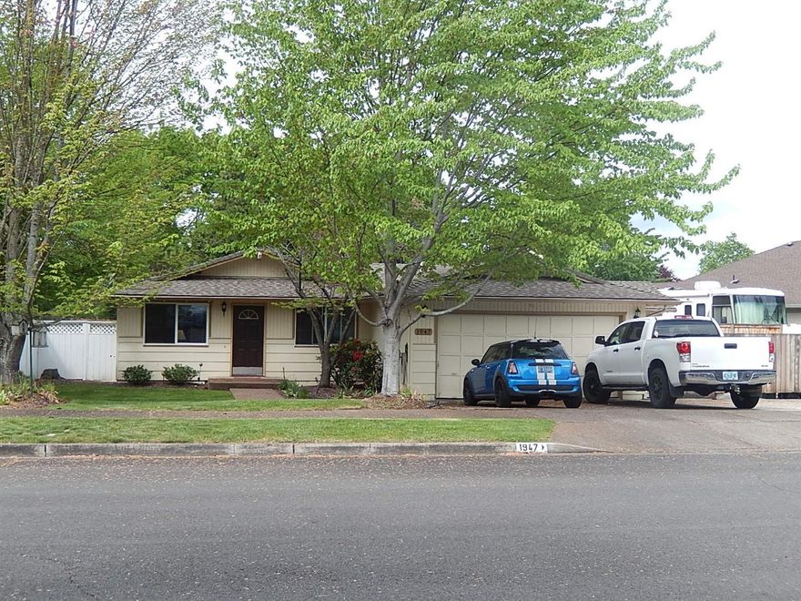 Lovely home on quiet dead-end street offers large living room, updated kitchen with tile flooring and big family room with gas fireplace. Both bathrooms have also been updated. There is access from family room as well as the master bedroom to the lovely spacious back yard with over-sized deck, hot tub and in-ground pool with newer liner. Seller has installed a multi-camera outdoor monitoring system - keep an eye on the kids in the pool from inside the house! There is also an outdoor sound system. In-ground sprinkler system both front and back. There is NEW: fencing, kitchen sink, dishwasher, glass-top range, garbage disposal, 40-gallon hot water heater, pool pump and newly remodeled pool house with tiled floor and third bath. The deck has been freshly painted. There is also a huge gated & concreted RV area to accommodate all your needs. Great home for entertaining guests or just enjoying on your own.