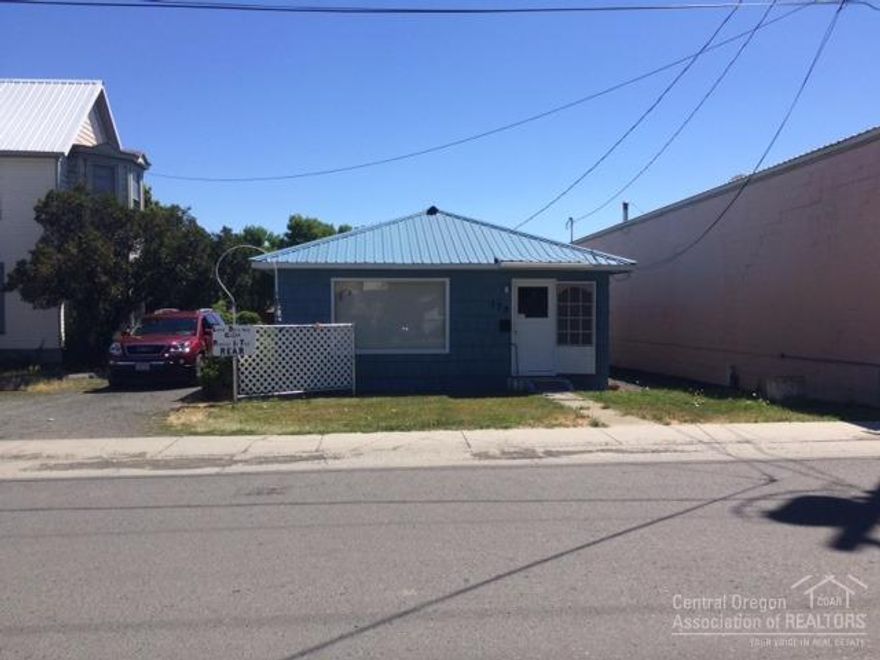 Commercial Property w/Apartment! Nice location, great potential for a small business owner looking for attached living space, currently being used as a beauty salon, apartment has private entrance, 1008 sq ft, built in 1950, 1 bedroom, 1.5 bath, propane heat, laminate & vinyl flooring, metal roof, landscaped, gravel driveway, carport, city services, salon equipment, fridge & range included, plenty of parking. $89,500 #898 OWC