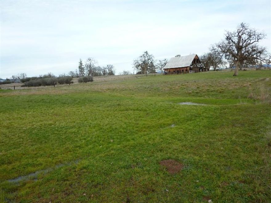 Beautiful pasture land, nicely treed with views of Mt. McLoughlin to the east. Some improvements including older home built in 1926 and some out buildings including large old barn. The property is mostly fenced and features a very good producing well per the owner, fenced garden area and a small possibly spring fed pond. Value is mostly in the land and the property is being sold in its AS/IS condition. Buyer to do own due diligence!