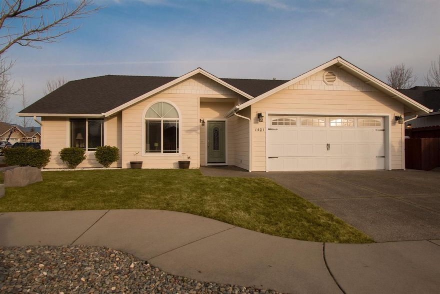 Sitting on a corner lot and constructed in 2004, this exceptionally clean 1501 square foot home has been thoughtfully designed with modern tastes in mind. Architecturally interesting interior with vaulted ceilings throughout allow a natural spread of light through the home. Home features a split floor plan, gas fireplace, large kitchen with built in wine refrigerator, recessed and accent lighting, solar tube, great room design and a master bedroom with dual vanities and dual walk in closets. The fully fenced back yard and back patio with custom pergola are very inviting for outdoor living and entertaining. Finished 2 car garage has additional space for a work shop and storage above.