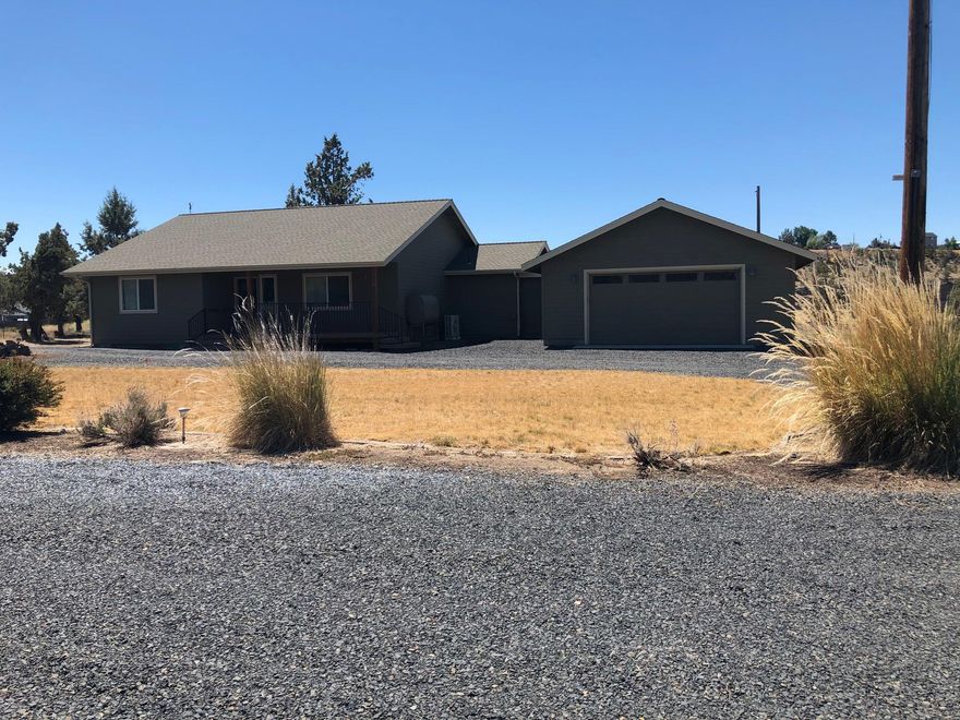 6.04 acres with a 1342 sq ft  2 bedroom 2 bath home  built in 2013.  Two car garage with  two garage doors.  All kitchen appliances and washer/dryer are included with sale.  Private well.  Several outbuildings.  This property has numerous possibilities.  Call today for a personal showing.