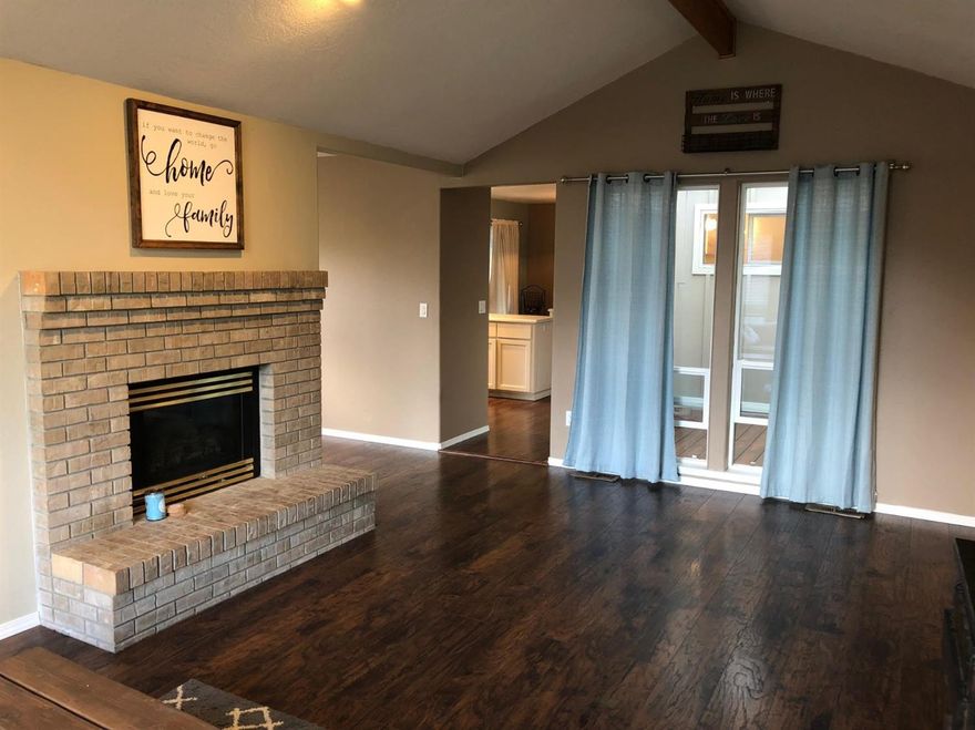3 bedroom 2 bath Jerry Toney built home located on a lovely tree lined street. Updated and well maintained with custom touches including new laminate flooring and stainless appliances. You'll love the functional layout, Brick fireplace, and bright kitchen with eat in dining area as well as formal dining room. Spacious master suite offers a walk-in closet and the secondary bedrooms are comfortably sized. The large laundry room features counter top/folding space, storage and a window that brightens the space. The yard is nicely landscaped and offers you room to garden with raised beds and irrigation. Located in a very walk-able neighborhood with winding streets, wide sidewalks and designated guest parking areas. Stroll through the beautiful nature paths and nearby golf course, views of the mountains from your living room and minutes to downtown Ashland. This is the perfect home for you. Turnkey and ready for you to move right in.