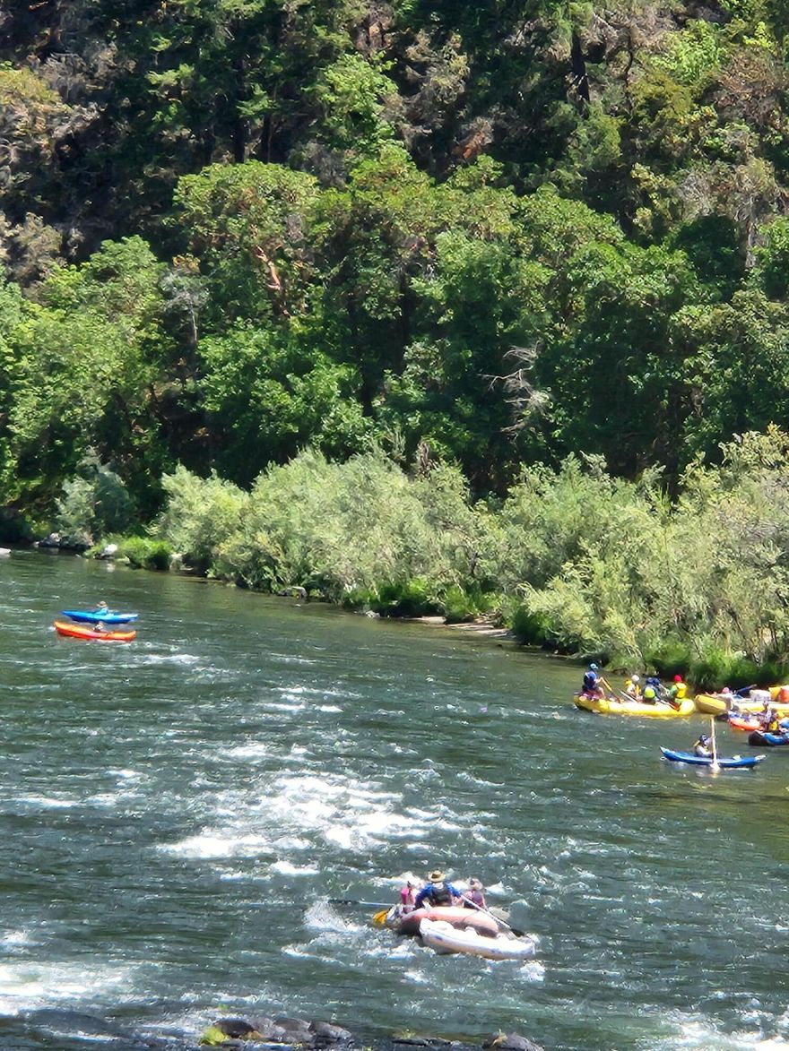 Beautiful Riverfront Oasis just waiting for your dream home to be built or moved onto the property!  Right on The Rogue River, Perfect for swimming, fishing, sunbathing, and more. Lovely private sitting comes with a FREE 420 sqft 1988 travel trailer with a Full bath, Full kitchen, Bedroom, and large Living room. bedroom and living room both have access to a beautiful large deck Large Propane tank included.  Plus a 160 sqft studio with full bath and kitchenette  and it's own deck for your quest. Septic has had brand new septic lines put in, in November of 2024 also water comes from a community 10,000 Gallon holding tank. manicured landscaping lawn going down to the water. This property is off the charts beautiful so many things to do. Better than going to a campground.