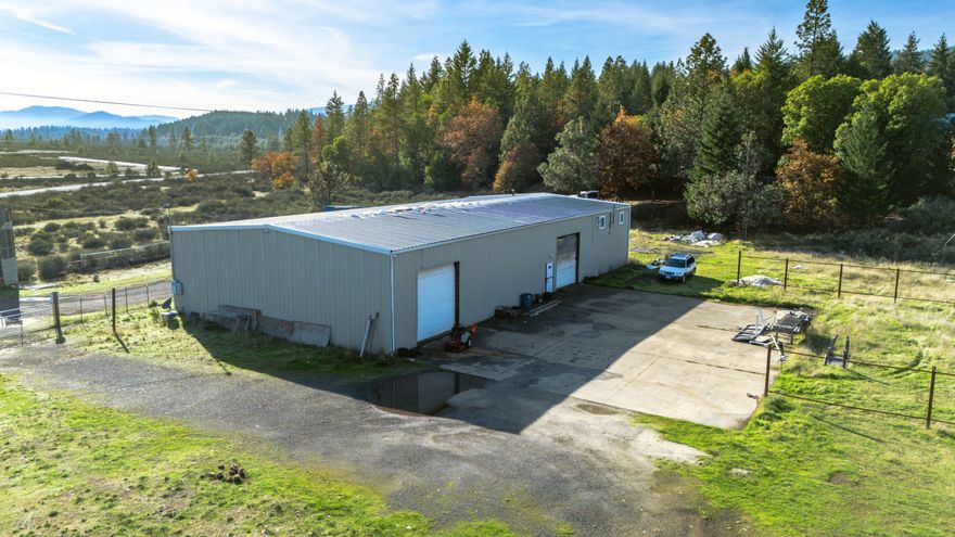 Serpentine Zoned 5.67 acres with a large 50'x100' steel building/shop.  Property has a 4 bedroom septic system installed. There are 4, 5-ton air conditioners included.    The 220' deep well pumps 5gpm.  The shop has a restroom that includes a functional toilet and shower.  Some upgrades have been added to the shop and property, including 600 amp power, permitted greenhouse,  2, 600 gallon holding tanks, fully fenced, and new access for commercial or private entry.  Serpentine Zone allows for many opportunities for use. Buyer are to due their due diligence on the intended use.