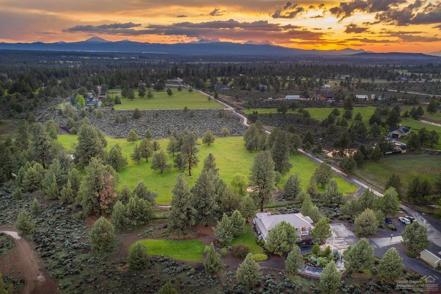 Come home to a park like setting within 10 minutes of town! Stunning 20 acre horse property with Cascade views. Beautiful remodel with a modern farm house theme, casual elegance. Great room layout and a deck that expands the length of the home overseeing the pasture and Cascades. This is an entertainer's dream home. With four bedrooms, 3 baths and a large entertainment/bonus room in the basement there is room for all. A HUGE shop including a brand new wood stove and a separate large storage area for recreational gear/hunting equipment. The land has 6 acres of underground irrigation with 2 ponds and a canal running through it. The back of the property has a motor-cross track for that dare devil in your family. There are multiple stalls for the animals, perfect for the horse lover or 4-H participant. Did I mention the green house and the tree house? This home has it all and is waiting for you!