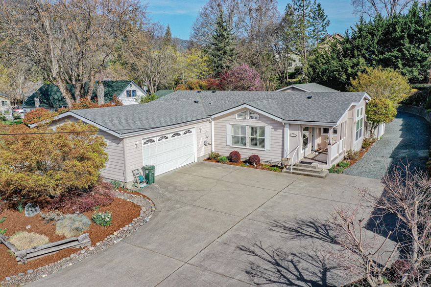 Gorgeous Large home on over a third of an acre, with huge SHOP AND attached oversized 2 car garage . From the minute you step onto this amazing property you will be in awe of the beautiful, landscaped grounds & the meticulously kept home (newer roof) & shop.  As you enter the home you will immediately appreciate the spaciousness, great design and the split floor plan. The home features a large open living/dining room AND a separate family room. Do you need a large cook's kitchen? You have found it in this well thought out spacious kitchen. You'll find a large primary bedroom with dual closests and a private en suite . When you step out into your amazing backyard you will delight in the awesome landscaping with many, many varieties of mature flowers, shrubs, trees & your own water feature! Have you dreamed of a workshop? This 720 square foot workshop will not disappoint. Maybe convert this space into guest quarters? R-2 zoning/multi family! (Check with City/County for feasibility)