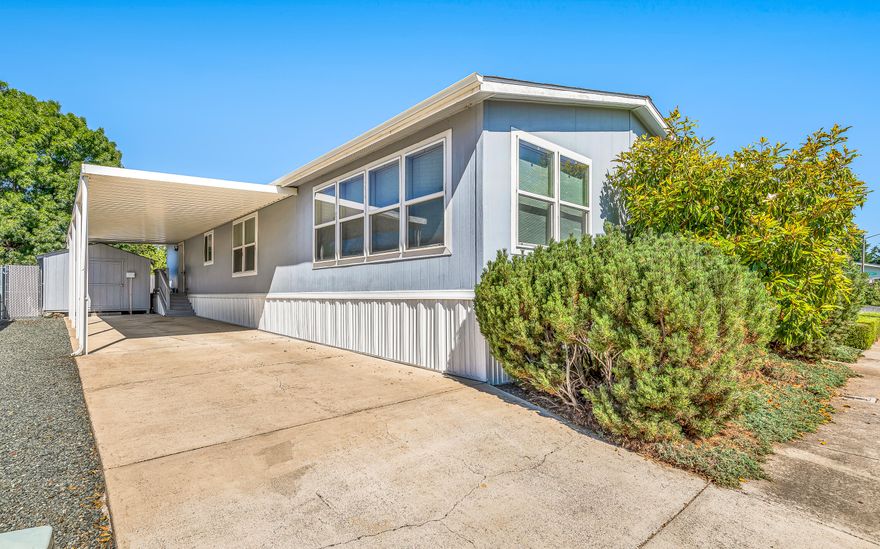 Welcome to this affordable spacious 3 bedroom / 2 full bath in Meadow View Estates all-ages park!!. Enjoy an abundance of natural light in this large1620-square-foot manufactured home which includes a living and family room, dining area, laundry area with utility sink, and newer laminate flooring. The kitchen offers a lot of cabinets for storage, all appliances included (Refrigerator, dishwasher, range oven, washer, and dryer) .  Outside there is covered parking for multiple cars a large shed and a ramp up to the house if needed. Great for first-time home buyers.