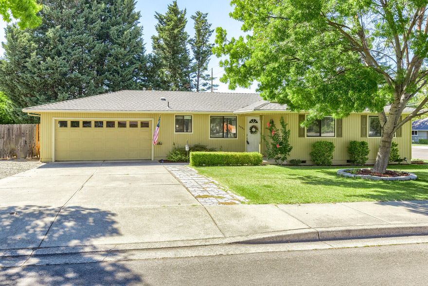 Nestled on just over a quarter of an acre with RV parking, this tastefully updated home exudes the perfect balance of comfort and charm. The inviting foyer welcomes you home as you step inside on laminate flooring which flows throughout the main living areas and the three bedrooms. The updated kitchen has beautiful granite counters, tile backsplash, and plenty of cabinet space! The primary suite is spacious and the updated ensuite has granite counters, tile floors, and step-in shower with tile surround and glass enclosure. The updated guest bathroom has granite counters with vanity area, and tub/shower with tile surround. A brick, wood-burning fireplace greets you as you enter the main living space with formal dining area and sliding door access to your expansive patio. The oversized backyard has mature trees, large deck, storage shed, hot tub, and a spacious grassy area. Conveniently located to nearby shopping and restaurants, you will cherish this turn-key home for years to come!