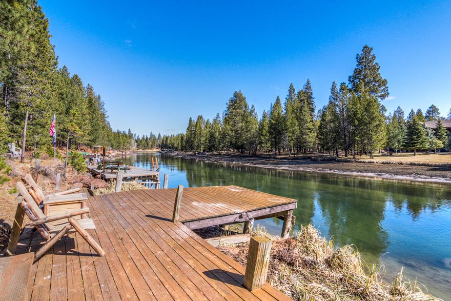 Unbelievably unique opportunity...It isn't often that a parcel like this comes along. First, there is a high quality home with a mountain feel on over 3/4 of an acre of Deschutes River frontage with dock. The open Great Room design spills out onto a covered deck with fireplace and a hot tub. A beautiful log stairway leads to a large loft, the Primary Suite with a large tiled bath and a bonus area. Next, there is a detached structure that matches the design of the home, also with river views, that has been an artists studio and muscle car hideaway in the past. Bring your imagination, it is the perfect ''blank canvas''. Mancave? Finally, there is a nearly 2600 s.f., 3 bay shop with two 10 ft. doors and a center bay with two 14 ft. doors so you can pull through. It is fully insulated with all new lighting and 110v /220v power. All of this is perfectly tucked between Sunriver, Caldera Springs and Crosswater Resorts and the National Forest, Mt. Bachelor and the High Lakes.

Welcome home...