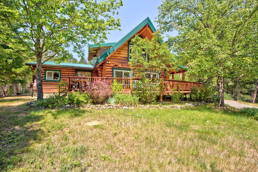 GREAT NEW PRICE! Beautiful custom home by Homestead Log Homes with metal roof, covered deck on 3 sides of lower level, & upper deck off the master. Home has 3 sources of heat; wood, propane, & ductless mini-splits To keep the home cool during warm weather. Appliances include refrigerator & washer that are less then 2 years old. The eat-in kitchen has a large pantry and convenient layout. Naturally this home has beautiful woodwork throughout & plenty of storage areas. Master has walk-in closet &  jetted tub. The property has two large water holding tanks with a very sophisticated underground watering system, garden area with electric deer proof fence, & 70' long green house. The garage is 24 x 30, totally  insulated, plumbed for a compressor, includes full bath with some work benches and shelving included and has an attached carport with electrical outlets. Fenced with electronic gate, lots of outdoor lighting & 2 RV dump stations. 1 year home warranty.  MOTIVATED SELLER