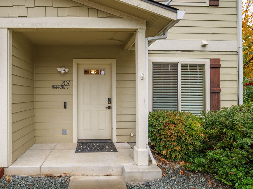 Whether you're looking to simplify with something smaller and easier to maintain, purchase your first home, or invest in a great rental opportunity, this beautiful townhome might be just what you've been searching for. It offers two bedrooms and two bathrooms—one of each conveniently located on both the main and upper levels. The upper floor features a thoughtfully designed kitchen with granite countertops, a pantry, and an adjoining dining area that opens to a bright living room. Double glass sliding doors lead to a private balcony, perfect for morning coffee or evening relaxation. Updates include a newer refrigerator, dishwasher, double oven, stove, and a brand-new HVAC system. The home also includes an attached one-car garage and is ideally located near I-5 for easy commuting.