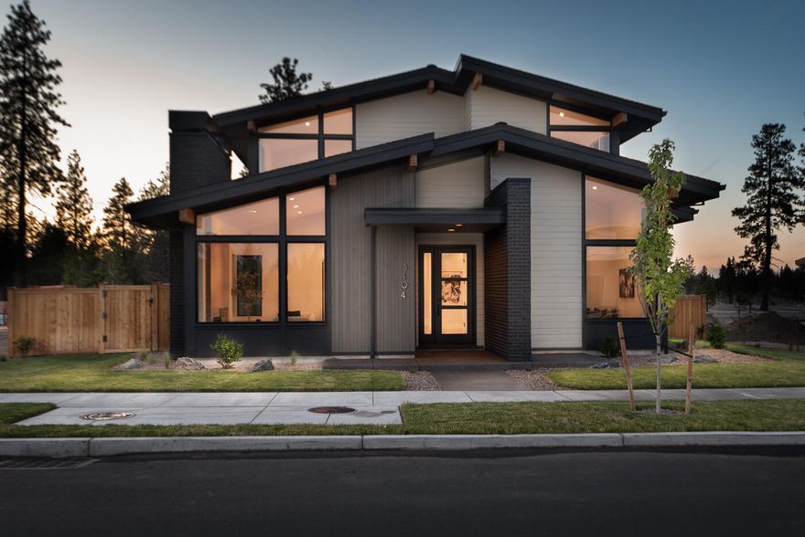 Contemporary elegance and mid-century charm in Discovery West. Meticulously crafted by Structure Development NW. Clean lines, open floor plan and a seamless integration of style and function define the essence of this home. Adorned with sleek finishes and large windows inviting an abundance of natural light into the living spaces. The open floor plan connects the living, dining, and kitchen areas, fostering a sense of togetherness while allowing for versatile living arrangements. Kitchen features high end appliances, custom cabinetry, and a central island serving as both a culinary workspace and a gathering spot for family and friends. Main level primary suite with ensuite bathroom, contemporary fixtures, and a walk-in closet. Additional rooms offer flexible accommodations for guests, family members, and home office. The Discovery West neighborhood itself offers a network of trails, parks, and community spaces, encouraging an active and connected lifestyle.