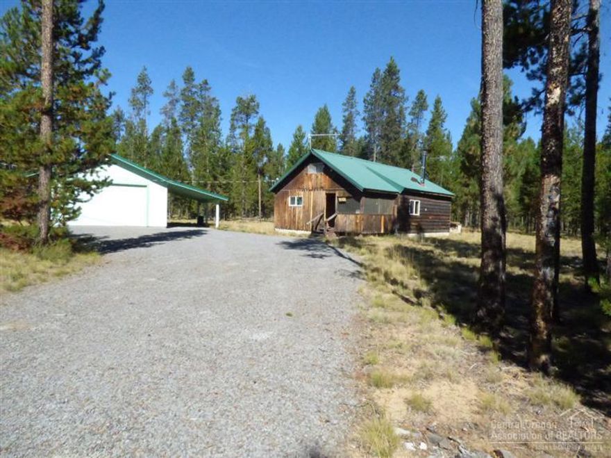 4.77 acres in the trees and tucked away from all the city hussle. 1bedroom and 1 bath with an upstairs loft with just room for a bed. Wall heaters, woodstove. Newer vinyl windows. 24x24 garage cement floor and shop heater, wired. All acres have been cleaned up of brush and some trees. Lots of wildlife including deer and elk.Newer septic system