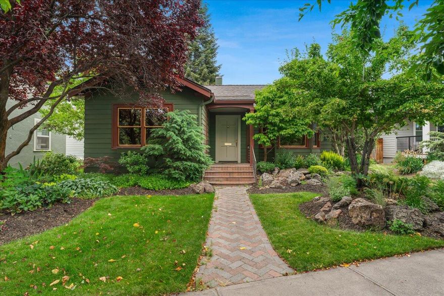 Charming 2-bedroom, 1-bathroom home that perfectly blends classic character with modern updates. Walkable to downtown Bend, the vibrant Westside, and scenic river trail from this highly desirable neighborhood location.
Step inside to discover gleaming original fir floors that showcase timeless craftsmanship throughout the freshly painted interior. Recent 2022 updates include newer roof, HVAC system, and water heater, providing peace of mind and reliable comfort for years to come.The outdoor spaces truly shine with professionally designed and landscaped grounds that create stunning curb appeal. The private back deck offers the perfect entertaining space for hosting guests or enjoying quiet moments surrounded by beautiful surroundings.This lovingly cared-for home combines authentic charm with modern conveniences.