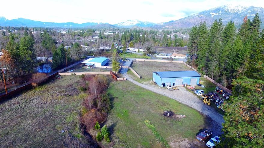 Location, location with easy access from both North & South bound exits off I-5. One prime 4 acre commercial site TL 701 has a 3 bed/2 bath plus office room 1664 +/- sq. ft. home and 40X80 metal sided shop with 24 ft. ceilings for large rigs. Site also includes prime 1 acre TL 702 with 40X100 steel building with 5 12x12 metal roll up doors plus office area and paved parking for 20 vehicles. Great opportunity for truck repair, sales, RV site sales, repair, towing for large & small rigs, storage, distribution etc. Owner motivated to sell and will help finance to qualified buyer with adequate down payment. MAKE OFFER! Buyer to do own due diligence, all information deemed accurate but not guaranteed and subject to change at any time.
