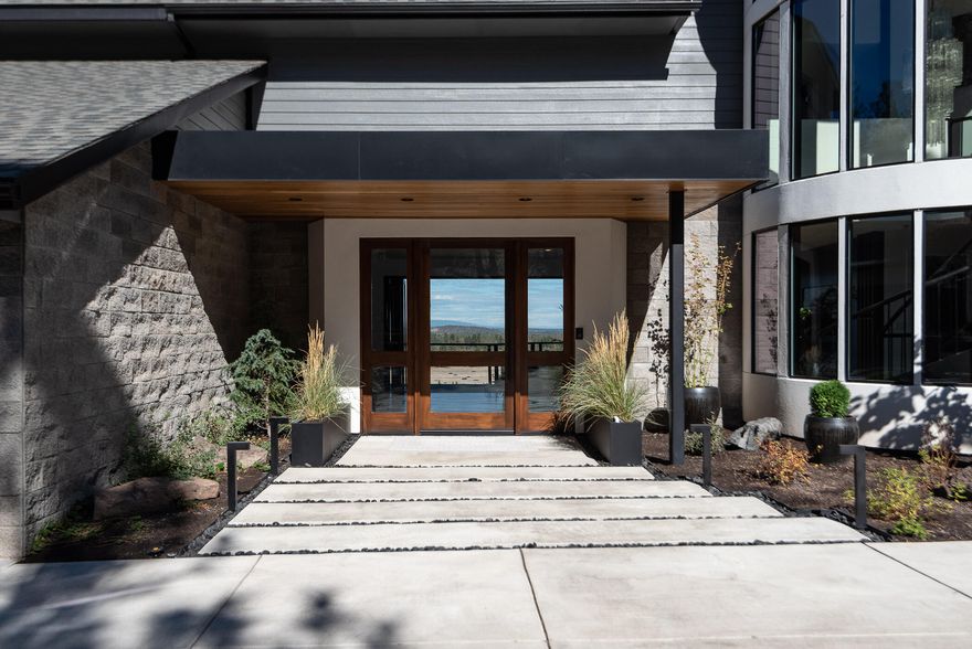 Views! Views! Views! A truly spectacular private setting with gorgeous views of the Cascade Mountains, Riley Ranch Reserve, and the beautiful Deschutes river. These incredible views are visible from nearly every room of the home. This property was meticulously remodeled top to bottom with hardwood floors, quartz countertops, high end appliances and solid walnut accents. The main home is 4,073 sf with 4 bedroom's, 3 baths, office and a large daylight basement with a media room and gym. In 2004, a fully permitted separate studio with additional oversized 2 car garage was added. The home is secluded on a private 1.25 acre lot at the end of a cul-de-sac with a flat driveway. A gorgeous 1600 sf deck runs across the entire home overlooking the bend in the Deschutes River Canyon. After you finish on your private 4- hole putting green, walk down the path to the river trail. Easy access to walk or ride your bike downtown. This home must be seen to be appreciated, truly irreplaceable!