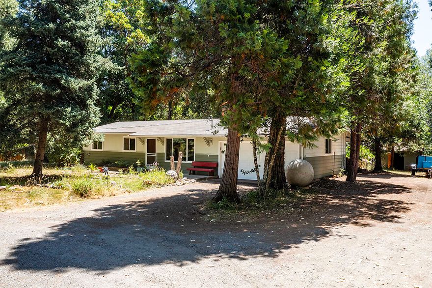 This 3-bedroom, 1.5-bath home offers 1,440 sq ft of living space and a large shop all on 1.83 acres with frontage on Williams Creek. Built in 1965, it's ready for your personal updates and creative vision. Enjoy nearby trails, creeks, and acclaimed wineries, all while soaking up serene country living. Plenty of room for gardens, outdoor entertaining, or simply relaxing by the creek. Don't miss this opportunity to make Applegate Valley home!
