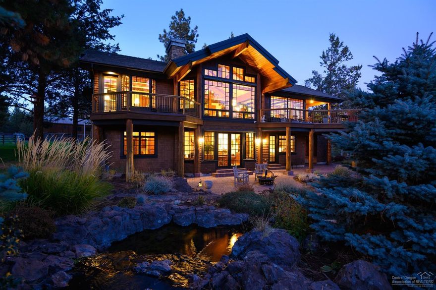 Exceptional Lodge style home with Cascade Mountain views, 3 bedrooms, 3 1/2 baths, secluded landscaped setting minutes to town in Sisters, Oregon. This never before on the market property designed by Steven Van Sant is graced with classic, Northwest charm, stunning use of timeless materials, thoughtful open floor plan, gourmet kitchen, 750+ bottle wine cellar, reclaimed heart pine floors, beamed ceilings, knotty alder woodwork, radiant heat throughout, and A/C. Situated on 9.41 acres, included are 3,585 SF MAIN residence built in 2003, sited to provide beautiful views from each of the rooms, a 3,456 SF BARN with complete guest quarters, workshop, additional charming bunk room, and barn stalls. Property includes fenced and cross-fenced pastures, 2 wells, a chicken run, paddocks, a winding creek, large pond with dock, and more. This rare and unique property provides privacy and genteel country living in a small, energetic town of great schools and bountiful outdoor activities.