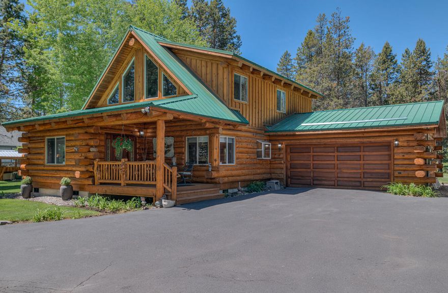 Beautiful log home on the Big Deschutes River. This home is a masterpiece of quality workmanship and charming detail that offers a unique and tranquil living experience. Imagine waking up daily in a log home set on the edge of the Big Deschutes River. Large balcony deck, patio deck, and a shared dock right in your backyard! You can fish and float from your property! Great Room floorplan with a cozy woodstove, perfect for those chilly nights. It offers a bedroom downstairs and an open master bedroom with a loft upstairs. Log beams and river rock accents add a touch of rustic elegance to the home. Custom windows allow plenty of natural light, enhancing the warm and inviting atmosphere. The property is surrounded by lovely, easy-care, and mature landscaping. With extra parking space, it's an ideal property for RV owners and those with 'toys' needing a home. Don't miss out on this unique opportunity to enjoy the magic of riverfront living in a home filled with charm and character.