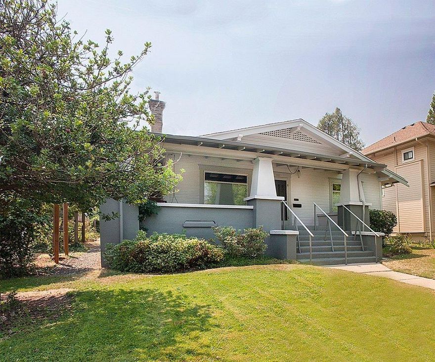 This original vintage Craftsman--the James N. Dennis house--still retains some of its original, artisan built-in cabinetry and authentic mill work details, with the plus of a newer addition. The single-level home features two original bedrooms with full bath plus the recent garden-side addition with second full bath, which could be a family room, office or third bedroom. In front is a classic Craftsman double-parlor or living/dining space leading to the kitchen (with custom-created tile backsplash by a leading Ashland artist), to a laundry and the addition. Enjoy Ashland's July 4th parade from the large, shady front porch! A private garden oasis and ample concrete-floor 1-car garage adjoins a rear service lane and additional 1-car off-street parking. Unfinished basement. This well-built historic home is a quiet, calm oasis just two blocks from downtown and close to a major grocery store and gourmet coffee shop. R2 zoning--for possible short-term rental or business use.