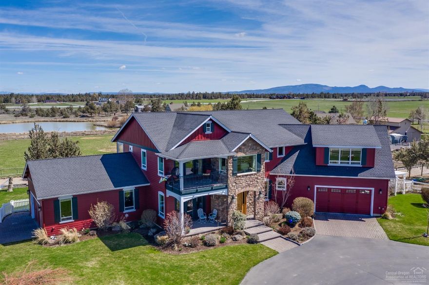 On Amber Pond just 5 minutes to Redmond is this grand country home and hobby ranch with 4 bedrooms/3.5 bath with views of Smith Rock and the mountains. Country casual luxury with natural woods. Relax in the master suite's sitting area and take in the mountain views or on the pavered patio. A jr. master is on the main level. Fabulous music room with french doors to the covered deck, and a media room/library. Outside are a putting green, gazebo, barn, playhouse, greenhouse, fenced garden area, fully fenced and cross-fenced irrigated pasture for animals AND his and her double car garages. Live the DREAM with all that Central Oregon has to offer. Ask for a list of property amenities.