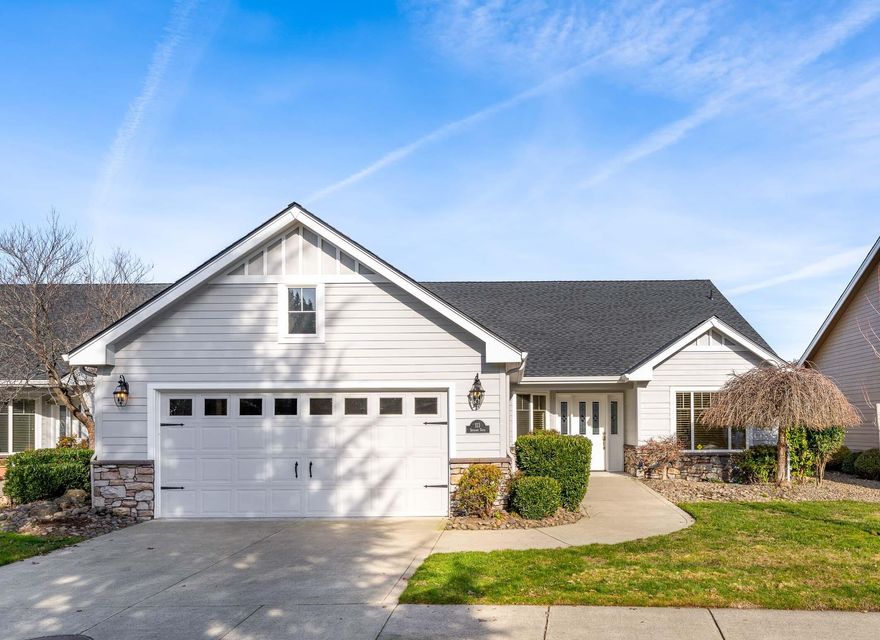 Great value in the esteemed Eagle Point Golf Community! These fabulous common wall homes in the gated community of Poppy Village sit within a stone's throw of the prestigious Eagle Point Golf Course. Spend time seasonally or make Southern Oregon your year-round home affordably. Open and spacious floor plan, natural lighting, full kitchen w/new granite slab counters, new white oak wood flooring, gas range, micro space saver, D/W, refrigerator, breakfast bar overlooking dining nook with additional separate formal dining, large living rm w/vaulted ceilings, ceiling fan, gas fireplace insert w/granite surround. End unit,  vaulted prim. suite w/access to covered rear patio and distant views of Mt. McLaughlin and golf course. Double sinks, walk-in closet, linen space, privacy toilet. Spacious laundry w/more granite, basin sink, an abundance of cabinetry. Gas heat, new AC unit 2024, dbl, car fin. gar. Near shopping, vineyards, recreation. New price, hurry!