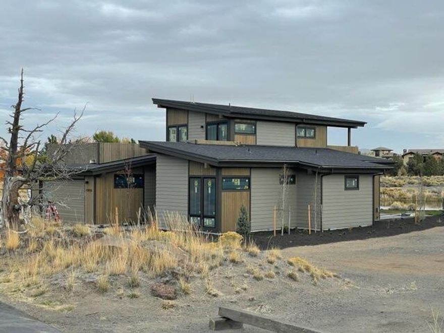 Beautifully executed new construction at Pronghorn Resort. Located within the resort's core and a short distance to Championship Golf on 36 pristine holes. Views of the full Cascade Range from the expansive deck and 2nd floor Suite. White Oak Hardwood flooring throughout, custom modern kitchen complete with beverage refrigerator, eating bar and dining area surrounded by glass. Take in and views of the lake and waterfall in the back yard from every room. Two Primary suites, one on each level. Luxury baths, walk-in closets, and a 3rd bedroom with full bath on the main level. Enjoy lots of outdoor living with a firepit and BBQ under cover on a generous sized paver patio. Pronghorn amenities including Spa, Fitness Center, Restaurant, Private Members Club, Dog Park are all here. And feel secure with a 24hr manned gate. This home can also be a short term rental if desired. Call for more details.